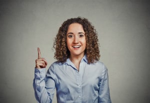 Surprised Woman Happy with How Dental Crowns Can Restore her Smile